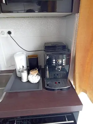 a coffee maker sitting on top of a kitchen counter at Liège centre Médiacité appartement possible parking terrasse immense 8ème pour 2 personnes in Liège