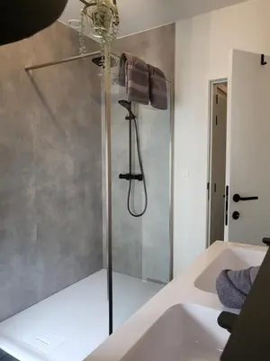 a bathroom with a shower with a glass door at Loogiez in Tongeren