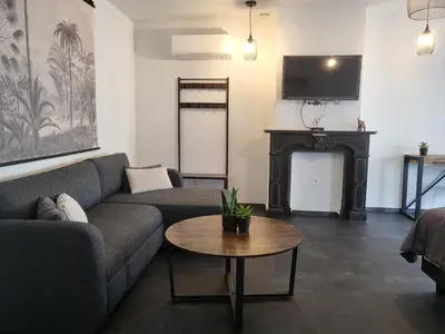 a living room with a couch and a table at Loogiez in Tongeren