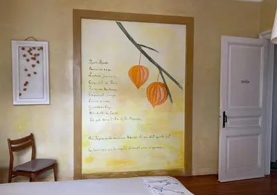 a painting on the wall of a bedroom at B&B Matin Tranquille in Liège