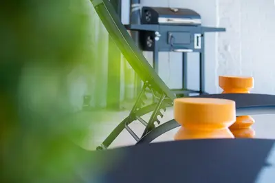 a close up of a table with some orange objects at Garden Guillemins Station in Liège