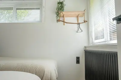 a bedroom with a bed and a basketball hoop on the wall at 't Bunga huiske in Lanaken