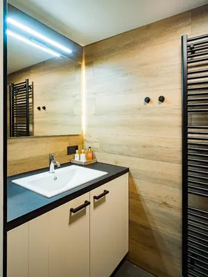 a bathroom with a sink and a mirror at Welldone Resort / Cozy Wine in Nieuwerkerken