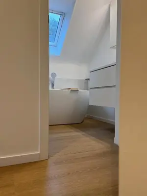 a bathroom with a sink and a bath tub at De Bovenbuur in Lummen