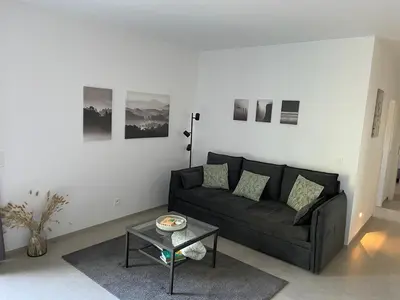 a living room with a couch and a table at Casa 47 in Eupen