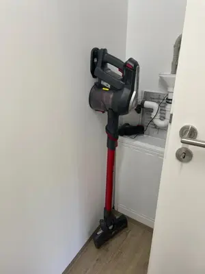 a black and red blow dryer in a room at Casa 47 in Eupen