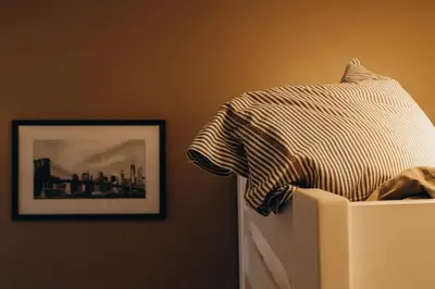 a shirt is sitting on top of a refrigerator at Liège City by WelcHome in Liège