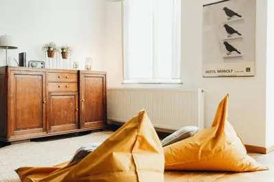 a living room with brown bags on the floor at Liège City by WelcHome in Liège