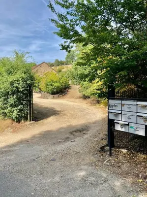a dirt road with a dresser on the side of the road at Le Val du Cossart by WelcHome in Verviers