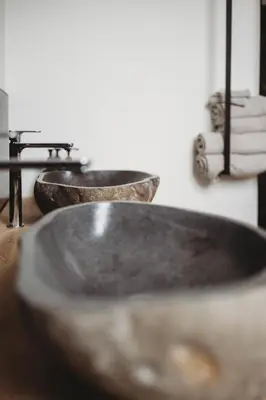 a group of three sinks in a bathroom at Eikenhoef in Lommel