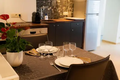 a table with plates and wine glasses on it at Cheval Blanc - Holiday Rental in Aubel
