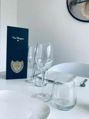 three empty wine glasses sitting on a table at Le Chalet du Pays de Herve in Herve