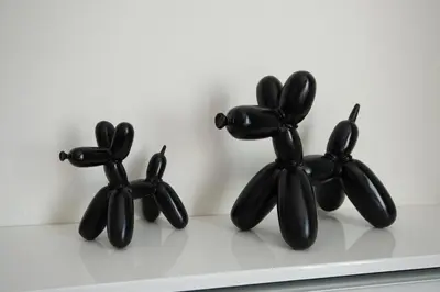 a group of black animal figurines sitting on a shelf at Appart'hotel Urban Lodge in Chaudfontaine