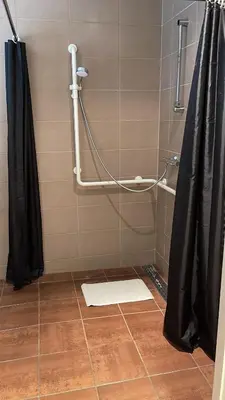 a bathroom with a shower with a shower curtain at Hotel de Boskar Houthalen in Houthalen-Helchteren