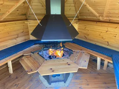 an overhead view of a fire pit in a wooden cabin at Gite Pays de Herve - Emeraude in Battice
