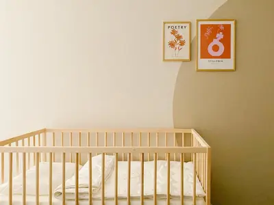 a crib in a room with a picture on the wall at 8P 4B Beautiful Villa with swimming pool in Zonhoven in Genk