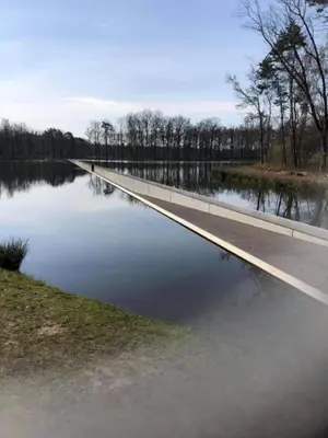 a road that is next to a body of water at Hengelhoef Berk 5 in Houthalen-Helchteren