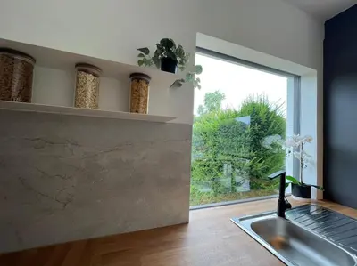 a kitchen with a sink and a window at Boldermountain Guesthouse in Heusden - Zolder