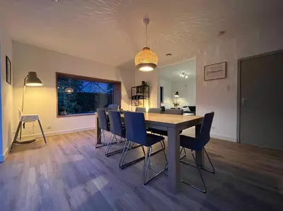 a dining room with a table and chairs at Boldermountain Guesthouse in Heusden - Zolder