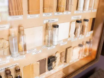 a display case in a store with many glass bottles at Achter de Hegge in Riemst