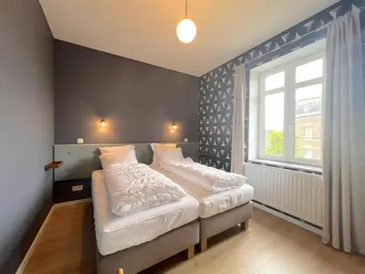 a bedroom with a bed and a window at Woonhuys in Riemst