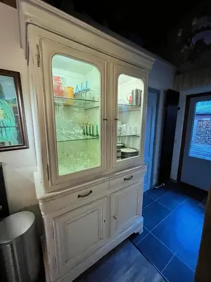 a large white hutch with two glass doors at Vakantiechalet voor 4 plus 2 met sauna in Lanaken