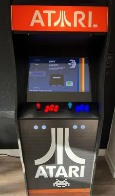 an atari stand with a video game in it at Appartement Verviers in Verviers