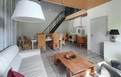 a living room with a couch and a table at Pet Friendly Home In As With Wifi in As