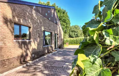 a brick building with a sidewalk next to it at Pet Friendly Home In As With Wifi in As