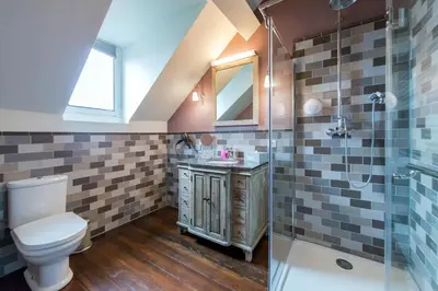 a bathroom with a toilet and a shower at Boutique Hotel Huys van Steyns in Tongeren