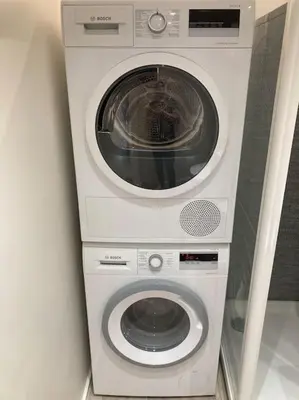 a washer and dryer stacked on top of each other at COCONUT MILK in Liège