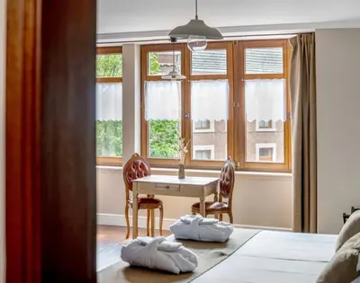 a dining room with a table and a window at Café René Borgloon in Borgloon