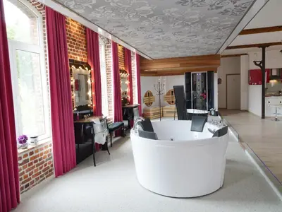 a salon with a white tub in a room with windows at Cozy Stay with Pool & Nature in Ensival