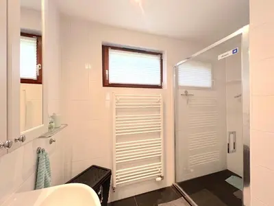 a bathroom with a shower and a sink at De Lelie in Rekem