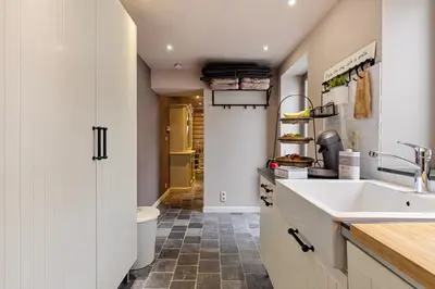a kitchen with a sink and a counter top at Bibi Tongeren in Tongeren