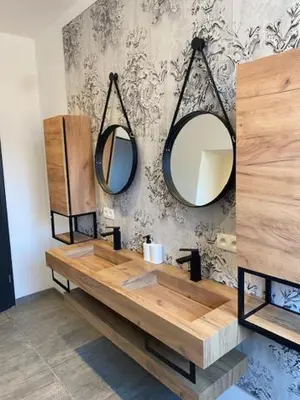 a bathroom with two mirrors and a wooden sink at Les Quais de la Vesdre in Verviers