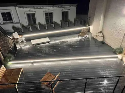 a group of chairs and benches sitting on the stairs at Maison avec 4 suites & Rooftop en plein centre ville - Place Saint Paul in Liège
