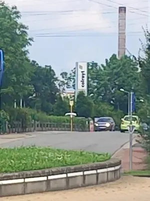 a street with cars driving down a road at Liege in Seraing