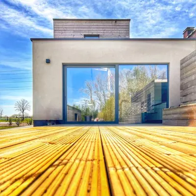 a house with a large window and a wooden floor at Inova - Comfort Room with Private Bathroom and Shared Facilities in Hasselt