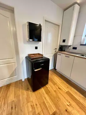 a kitchen with a small island in the middle of a room at Le Neuvice - Place du marché, Quais, Bueren in Liège