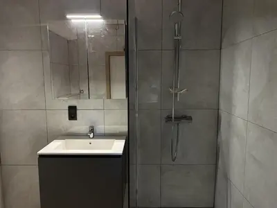 a bathroom with a sink and a shower at 8P 4B Beautiful house with 4 bedrooms in Hees in Bilzen