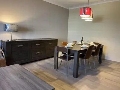a dining room with a black table and chairs at 8P 4B Beautiful house with 4 bedrooms in Hees in Bilzen