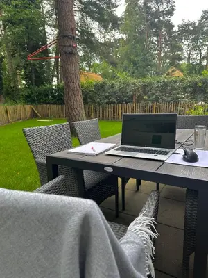 a laptop computer sitting on top of a table at Vakantiewoning Waag in Rekem