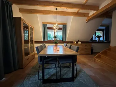 a dining room with a table and chairs at Vakantiewoning Waag in Rekem