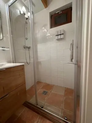 a bathroom with a shower with a glass door at Vakantiewoning Waag in Rekem