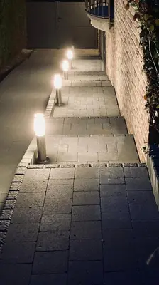 a row of lights on a sidewalk at night at Au coeur du 11 in Beyne-Heusay