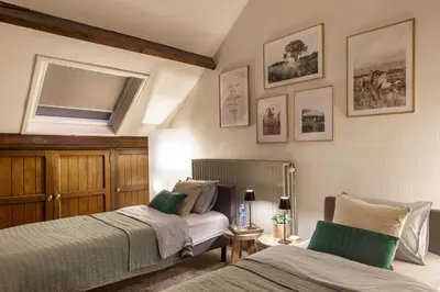 a bedroom with two beds next to each other at Vakantiewoning 'De Teut' in Zonhoven