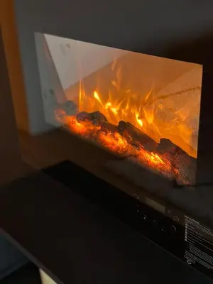 a microwave oven with a fire inside of it at Suite Marie in Verviers