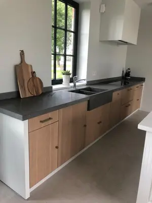 a kitchen with a sink and a counter top at Huis Hygge in Peer