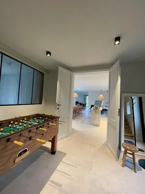 a room with a pool table and a dining room at Huis Hygge in Peer